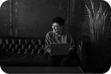 An individual completing an assessment on a laptop at home
